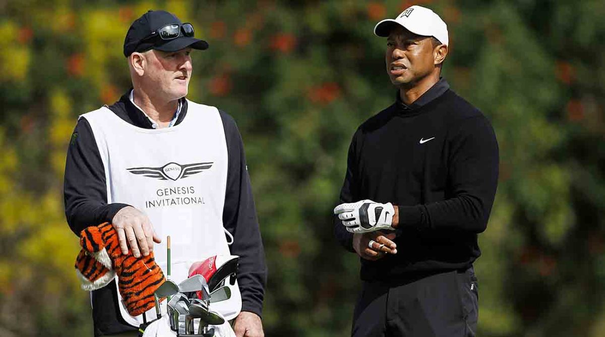 Caddie Joe LaCava and Tiger Woods talk over a shot at the 2023 Genesis Invitational.