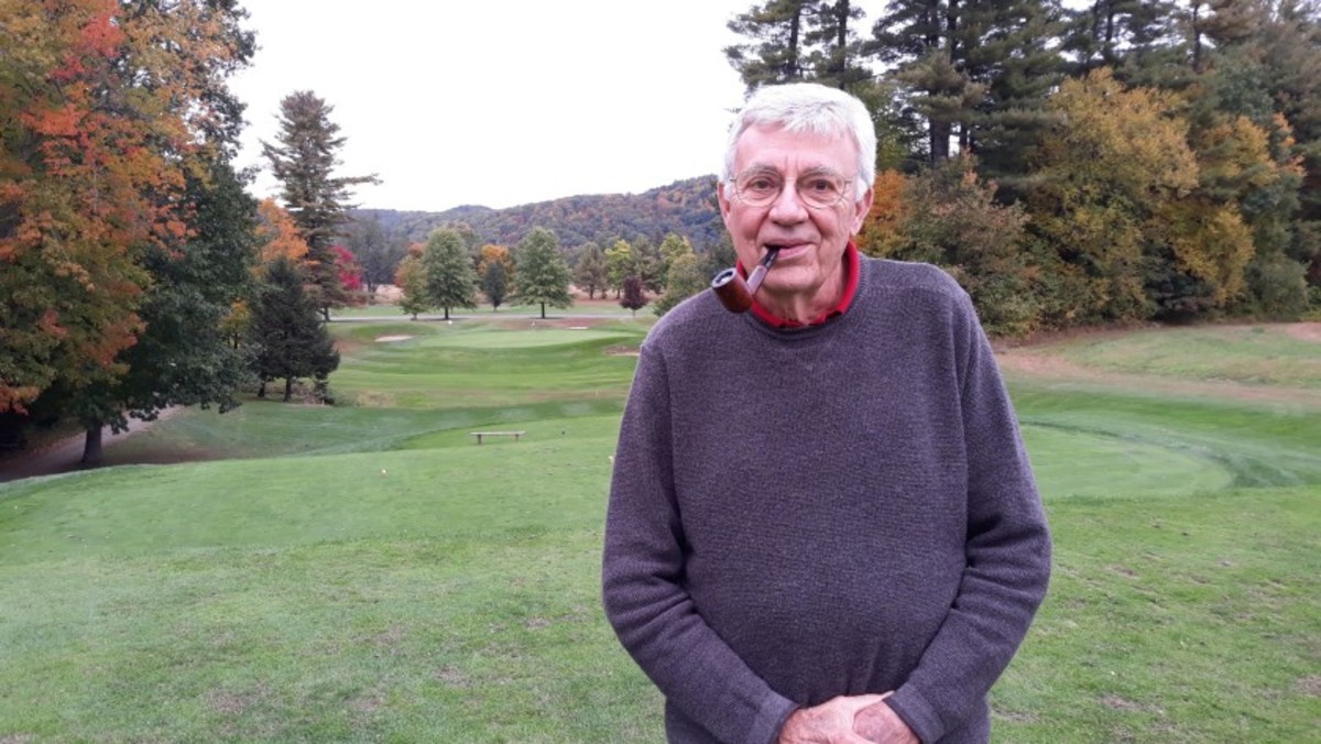 Roger Rulewich is known to pull out his pipe while enjoying a round of golf, which he still plays at 83. 