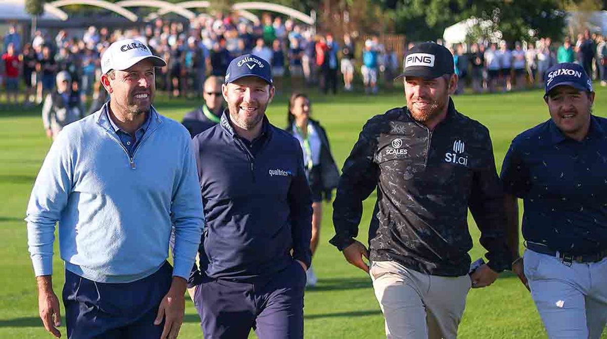 Individual winner Charl Schwartzel walks alongside teammates Branden Grace, Louis Oosthuizen and Hennie du Plessis, who also won the team competition.