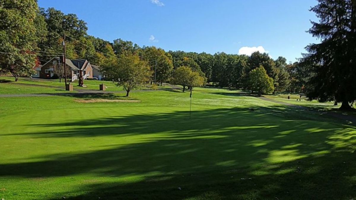 Foxburg Country Club's sixth is a straightforward par-3 hole whose charm comes from the tall strand of trees to the left and behind the green that cast long shadows.