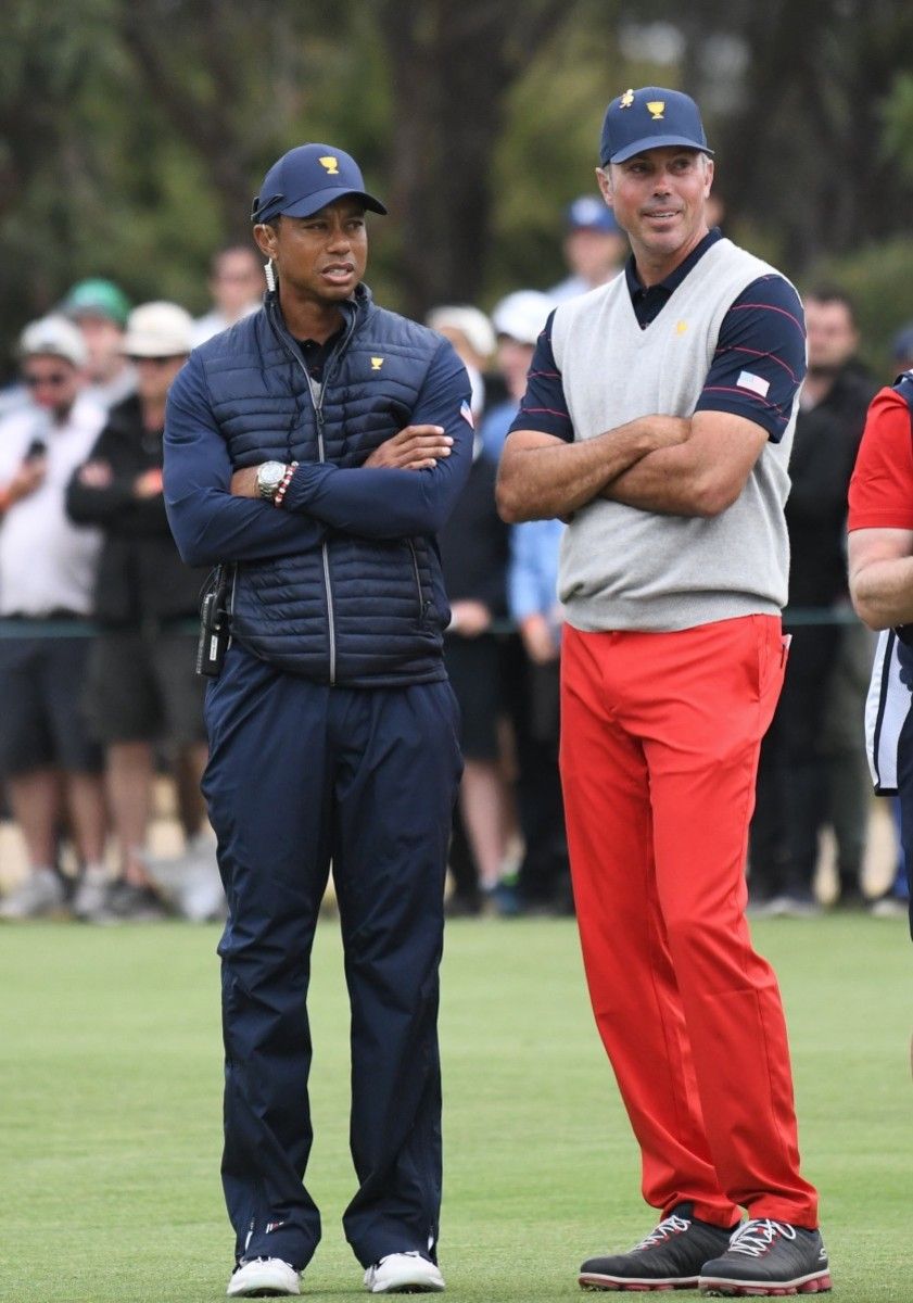U.S. captain Tiger Woods (left) and Matt Kuchar watch Saturday at Royal Melbourne as the Americans close the gap against the Internationals in the Presidents Cup.