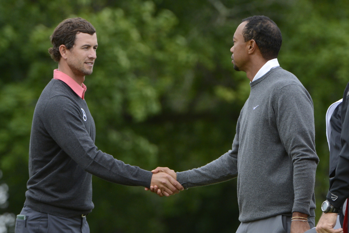 Adam Scott and Tiger Woods shake hands after the first round of the 2013 U.S. Open at Merion Golf Club.