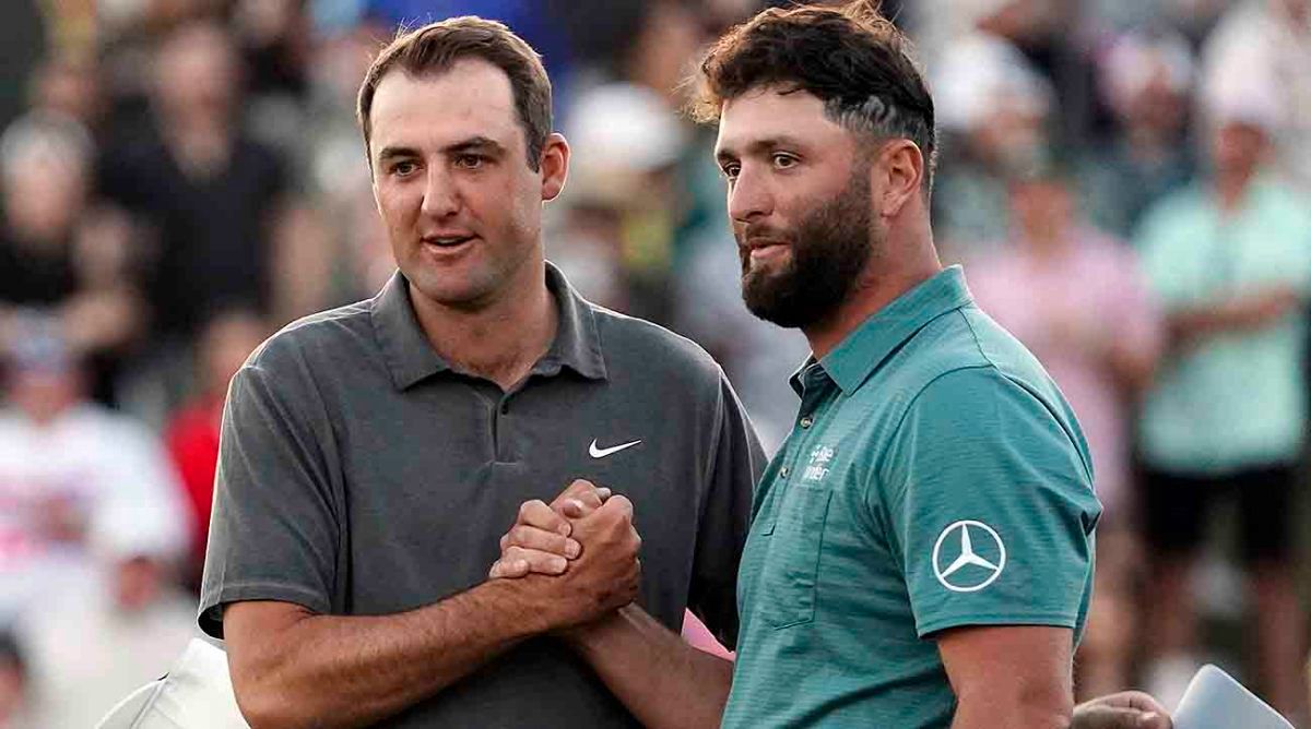 Scottie Scheffler and Jon Rahm shake after the third round at the WM Phoenix Open.