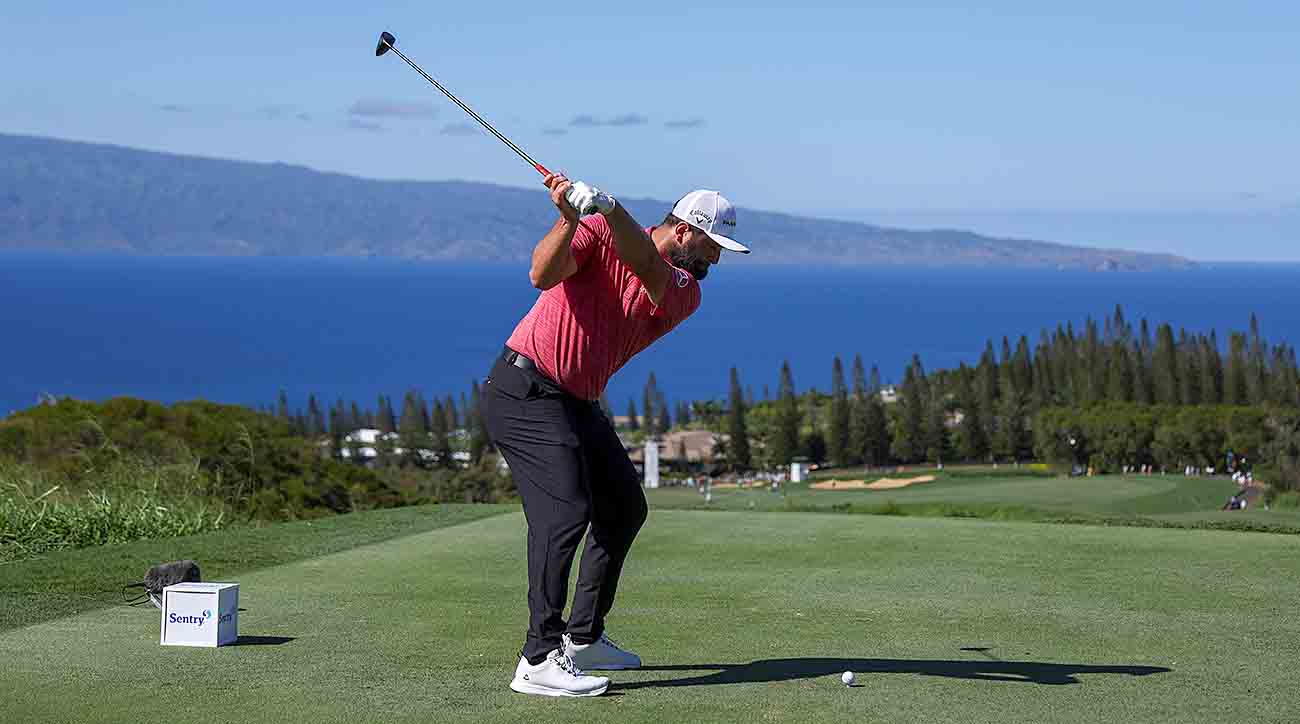 Jon Rahm plays his shot from the 17th tee during the final round of the 2023 Sentry Tournament of Champions at the Plantation Course at Kapalua Golf Clubin Lahaina, Hawai‘i.