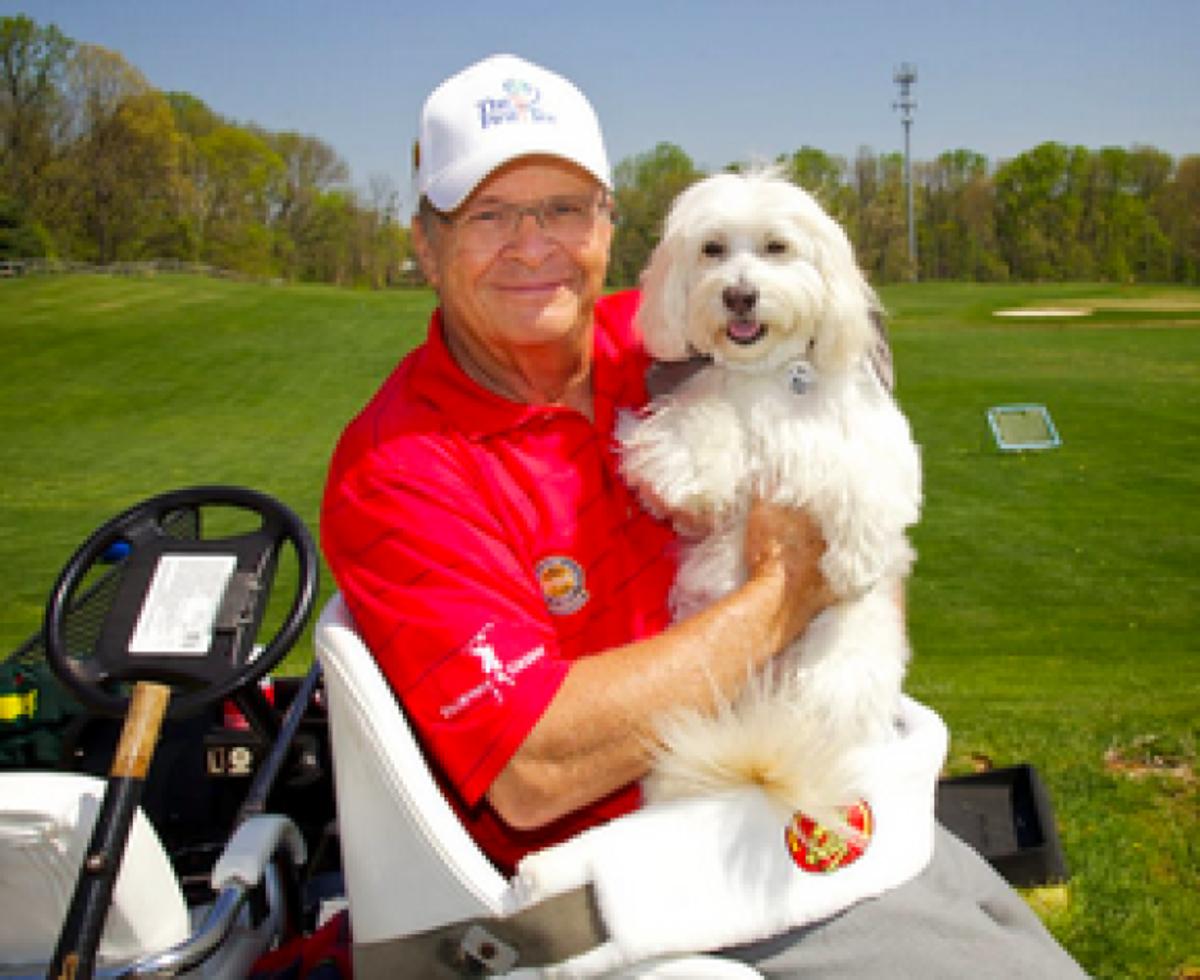 Dennis Walters, with his sidekick Bucky, has performed more than 3,000 trick-shot shows from his modified cart.