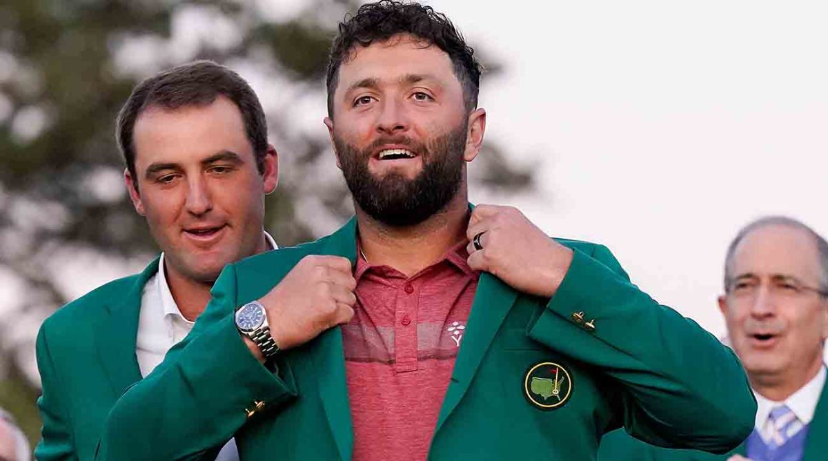 Jon Rahm slips on the green jacket after winning the 2023 Masters.