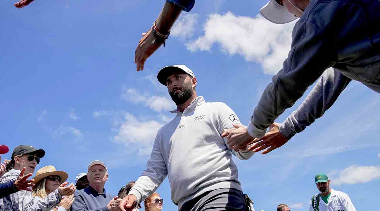 Jon Rahm makes his way to the first tee box during the final round of the 2023 Masters.