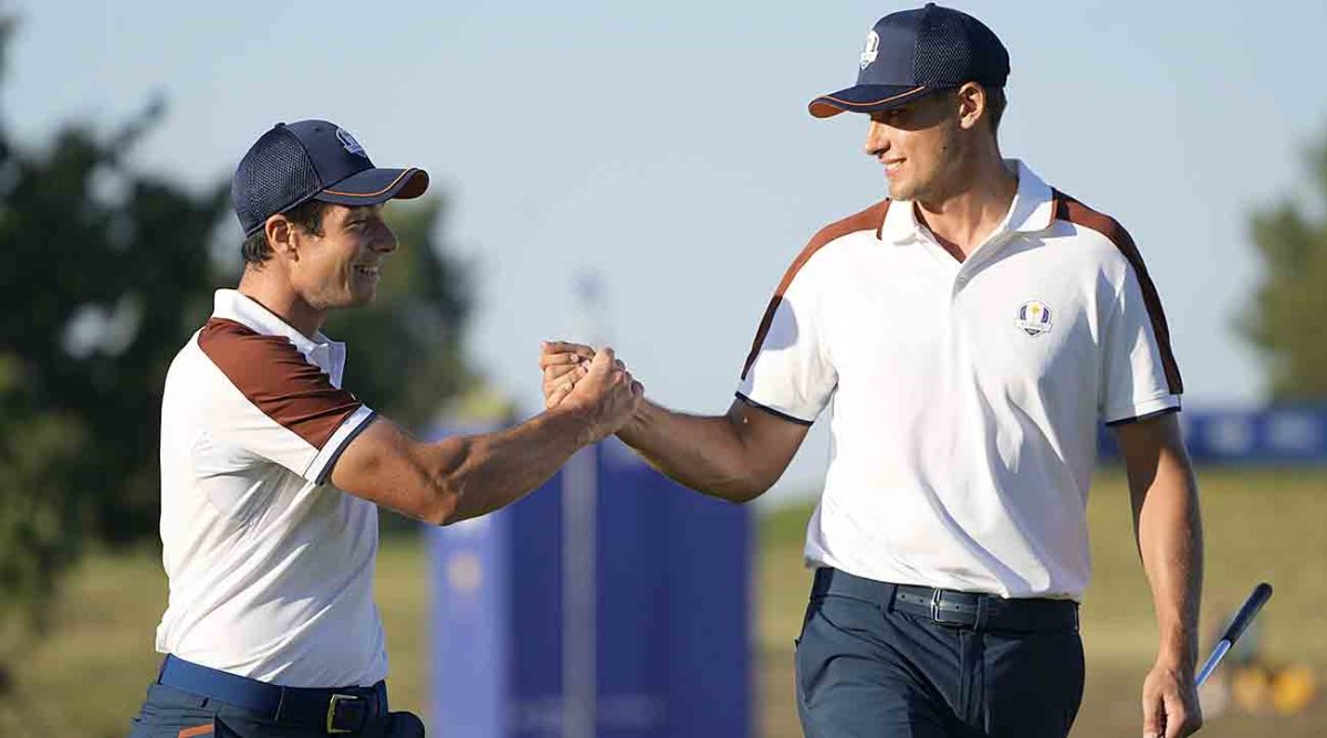 Europe's Ludvig Aberg, right, and partner Viktor Hovland celebrate during their morning foursomes match at the 2023 Ryder Cup.