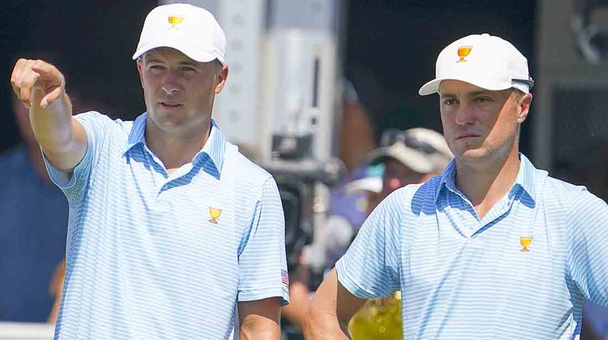 Jordan Spieth and Justin Thomas look on from the first tee on the opening day at the 2022 Presidents Cup.