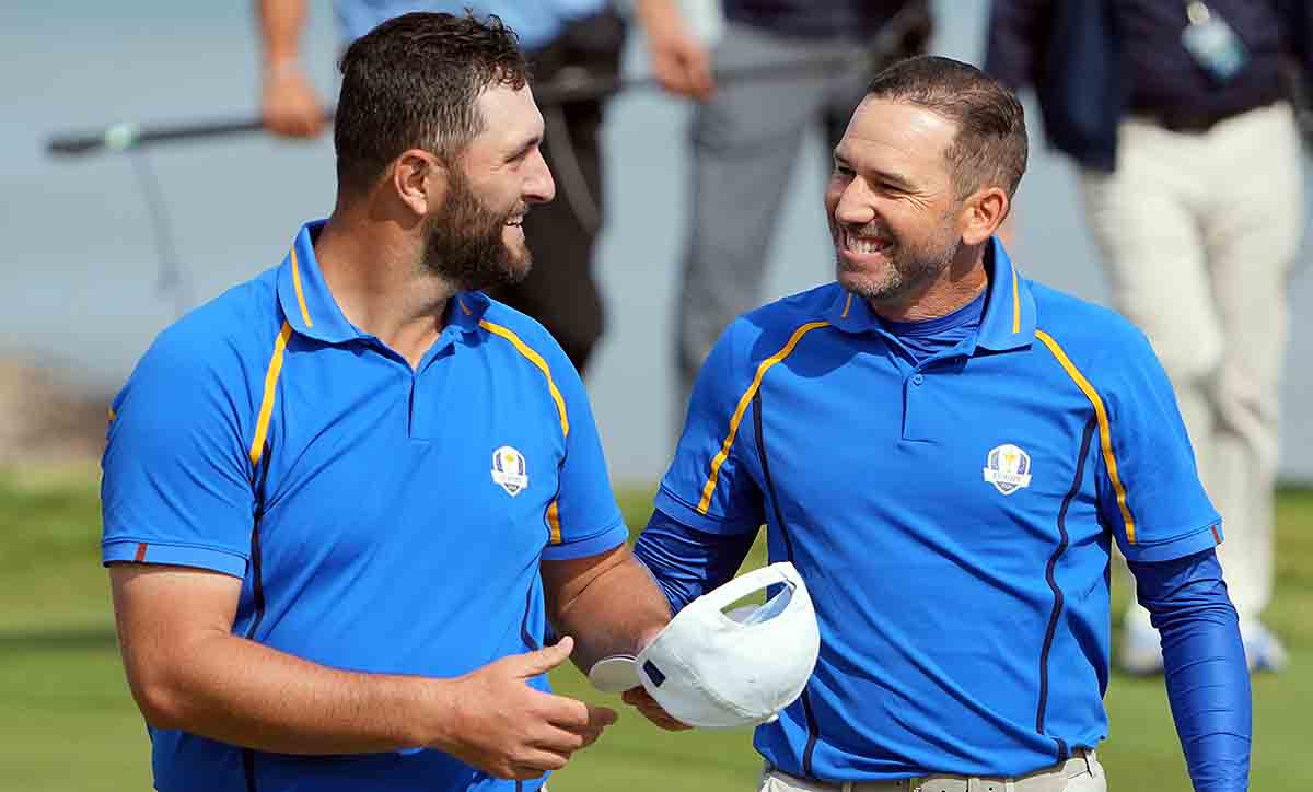 Team Europe player Jon Rahm celebrates teammate Sergio Garcia on the 17th green during day one foursome rounds for the 43rd Ryder Cup in 2021.
