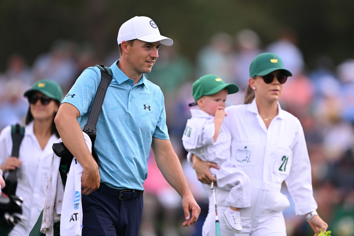 Jordan Spieth of the United States looks on with his wife, Annie Verret Spieth and son, Sammy Spieth walk off the first hole during the Par 3 contest prior to the 2023 Masters Tournament at Augusta National Golf Club on April 05, 2023 in Augusta, Georgia.