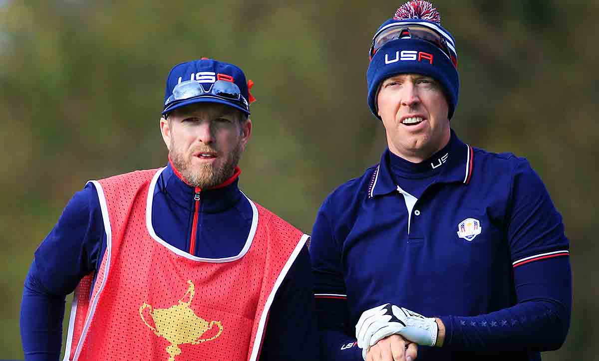 Hunter Mahan talks to caddie John Wood on the seventh tee during the Morning Fourballs of the 2014 Ryder Cup on the PGA Centenary course at the Gleneagles Hotel in Auchterarder, Scotland.
