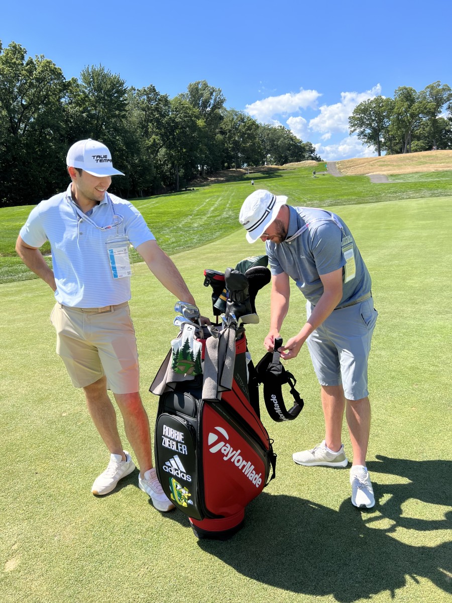 A TaylorMade staffer attached a second strap to Robbie Ziegler's golf bag at the 2022 U.S. Amateur.