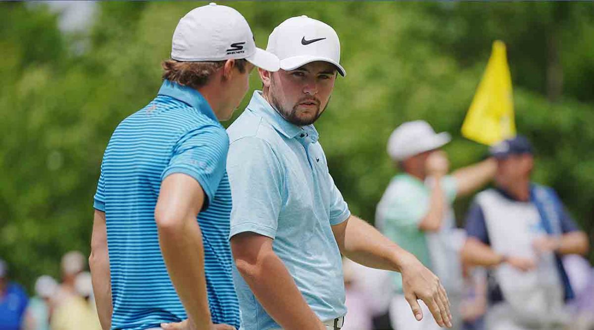 Alex Fitzpatrick (right) talks with brother Matt Fitzpatrick at the 2023 Zurich Classic of New Orleans.