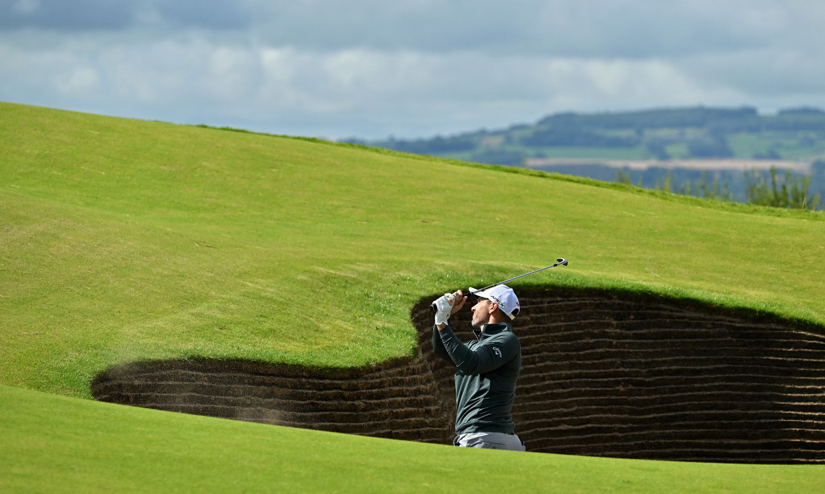England's Oliver Wilson plays out of a bunker on the 17th hole during a practice round for 151st British Open Golf Championship at Royal Liverpool Golf Course in Hoylake, north west England on July 19, 2023.