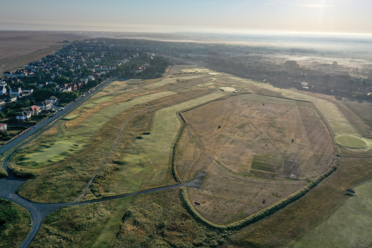 An aerial view from behind the green of the par 5, 18th hole (centre) for the 2023 Open Championship (this hole plays as the 16th hole on the club routing) at Royal Liverpool Golf Club on August 08, 2022 in Hoylake, England.
