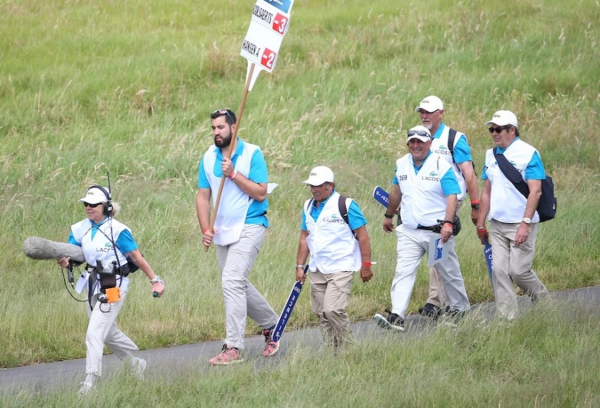 Marshals provide a variety of services at professional golf tournaments and help hold the line on the game’s decorum. 