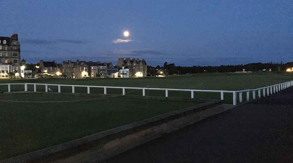 The moon lights The Old Course in St. Andrews, Scotland.