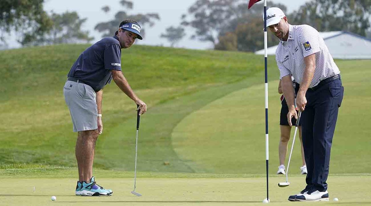Bubba Watson and Webb Simpson look over putts in a 2021 U.S. Open practice round.