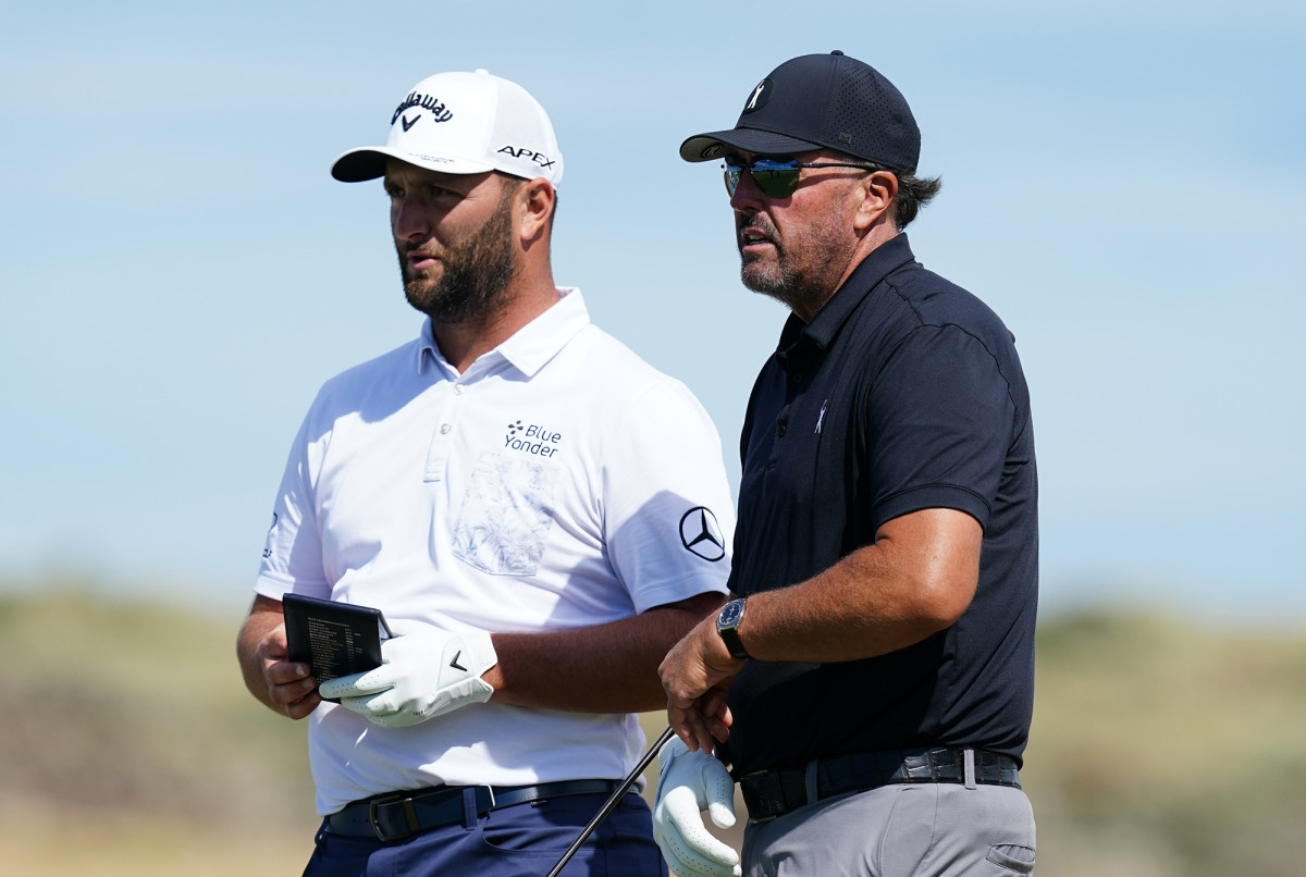 Jon Rahm and Phil Mickelson are pictured.