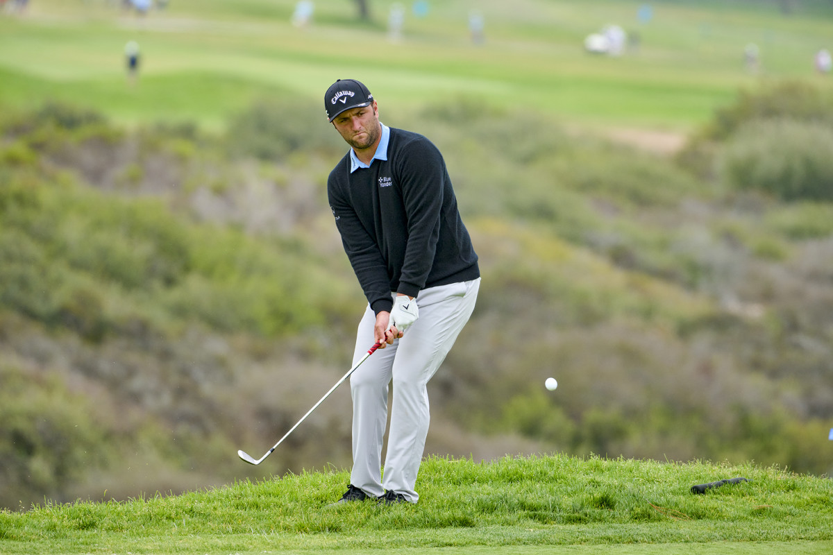 Jon Rahm watches a chip at Torrey Pines at the 2021 U.S. Open.