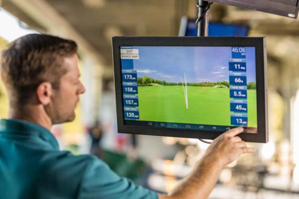 PHOTO COURTESY OF TOPGOLF The in-bay monitors at Toptracer Range-equipped driving ranges provide users with instant feedback.