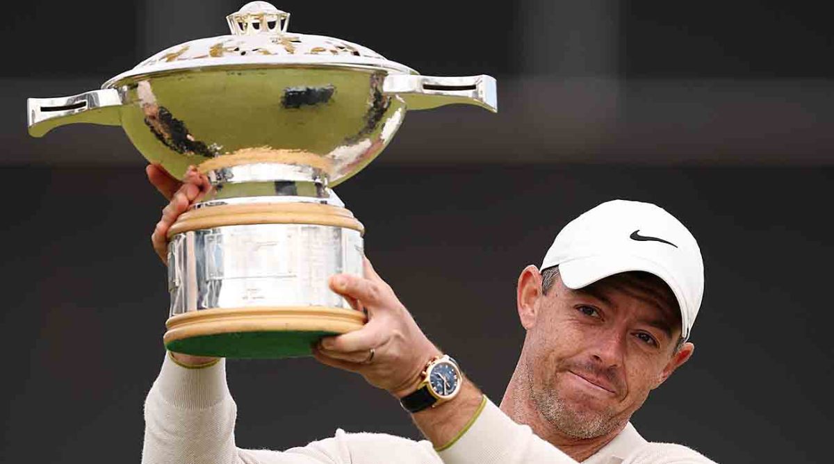 Rory McIlroy poses with the trophy after winning the 2023 Genesis Scottish Open.