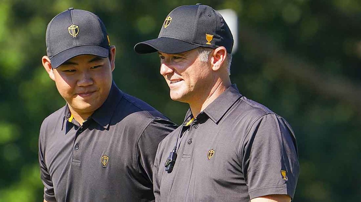 2022 Presidents Cup International team captain Trevor Immelman (right) visits with Tom Kim during a practice round.