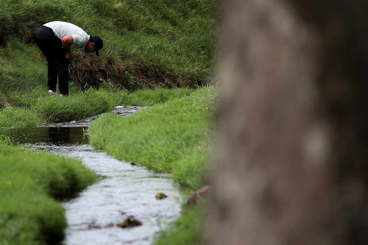 Brooks Koepka looks for his ball during the 2020 Memorial Tournament at Muirfield.