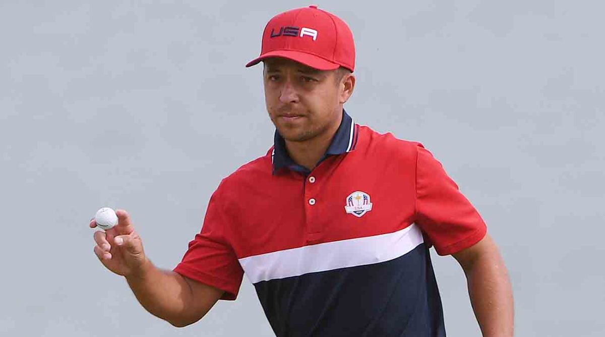 Team USA player Xander Schauffele waves after his putt on the third green during day three singles rounds for the 43rd Ryder Cup golf competition at Whistling Straits.