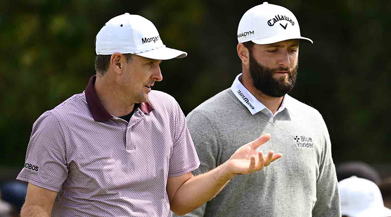 Justin Rose of England and Jon Rahm of Spain interact during Day Two of The 151st Open at Royal Liverpool Golf Club on July 21, 2023 in Hoylake, England.