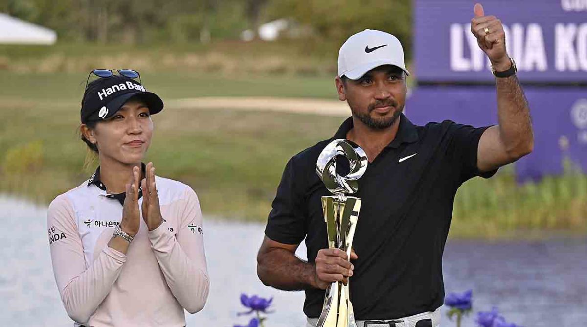 Lydia Ko, left, and Jason Day, right, celebrate with the championship trophy after winning the 2023 Grant Thornton Invitational in Naples, Fla.