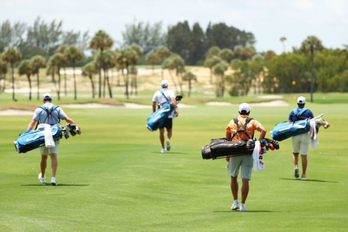 PGA Tour stars Rory McIlroy (from left), Dustin Johnson, Rickie Fowler and Matthew Wolff, socially distant and socially conscious, play without caddies but with a sense of purpose Sunday at Seminole Golf Club in a benefit match for coronavirus relief.