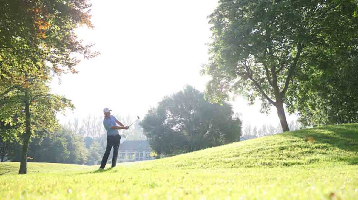Tom Hoge swinging a golf club