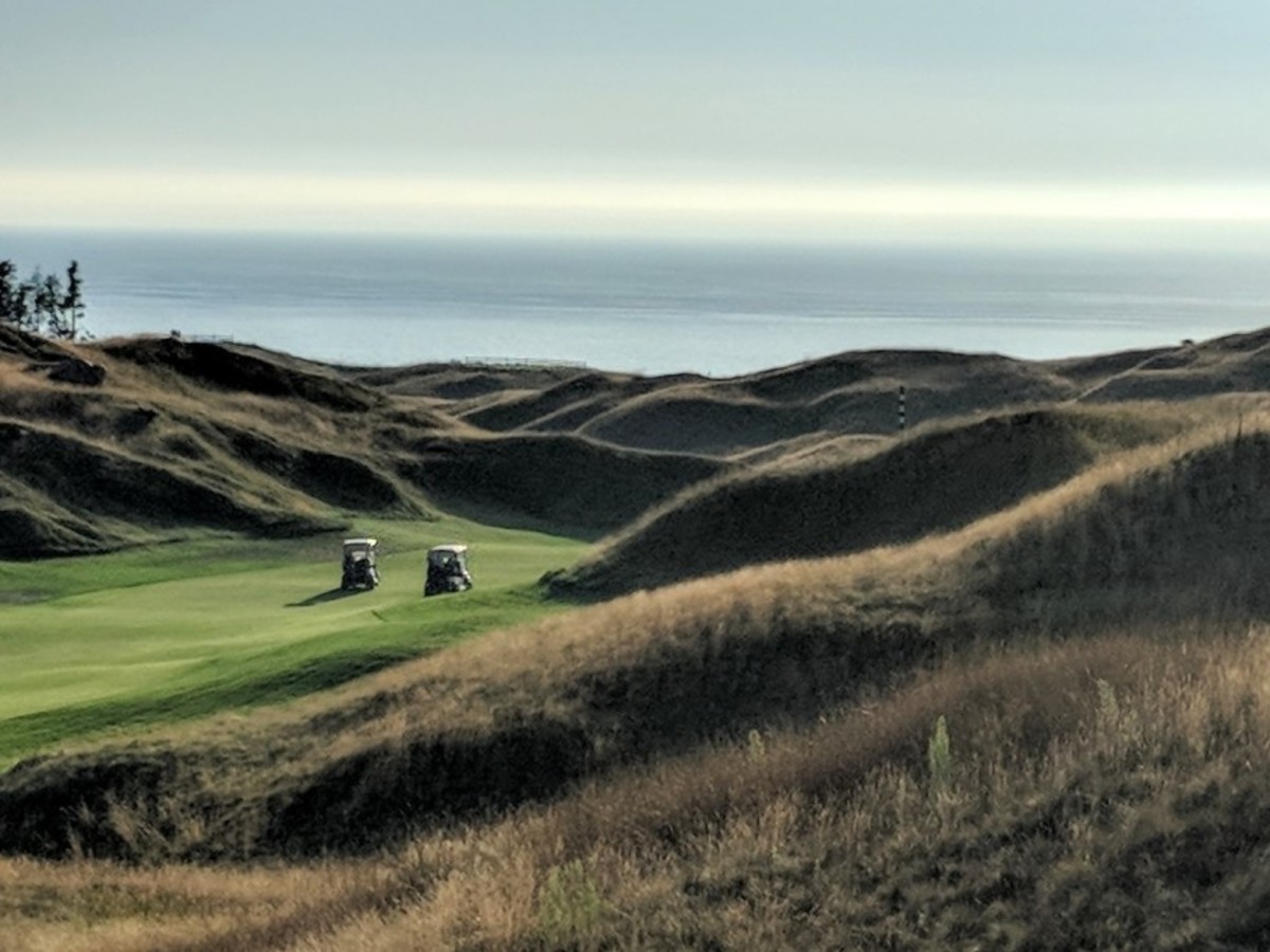 Extensive mounding shapes Arcadia Bluffs, with Lake Michigan as the backdrop. 