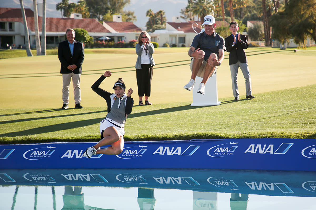 Patty Tavatanakit and her caddie leap into Poppy's Pond at the ANA Inspiration.