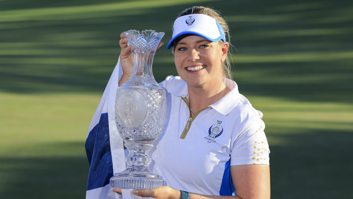 Matilda Castren of Team Europe holds the Solheim Cup after defeating Team USA during competition rounds of the Solheim Cup golf tournament at Inverness Club.