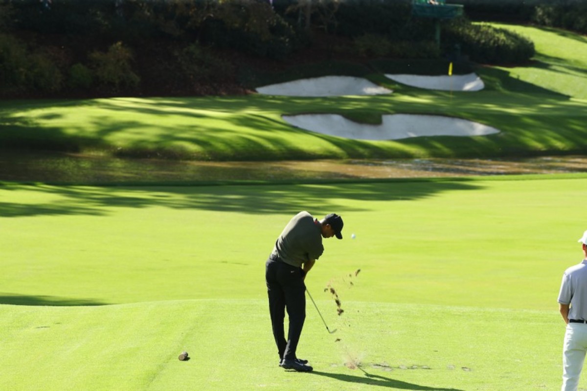Tiger Woods plays the par-3 12th hole at Augusta National en route to an opening-round 68. 