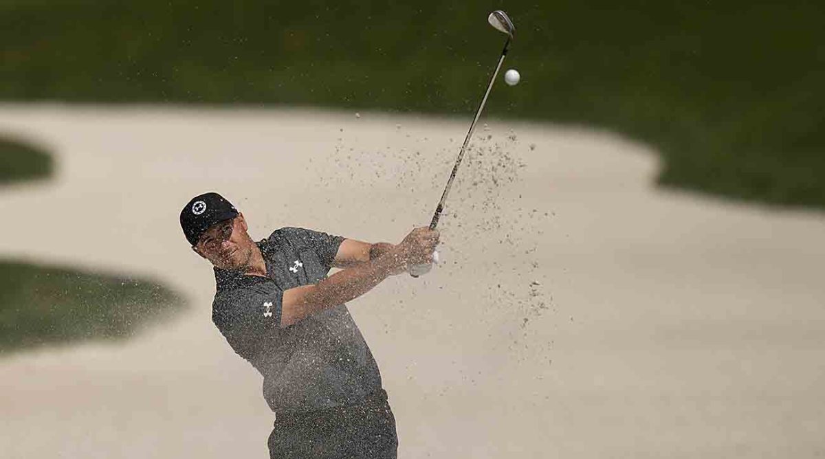 Jordan Spieth plays from a bunker during the 2023 Players Championship.