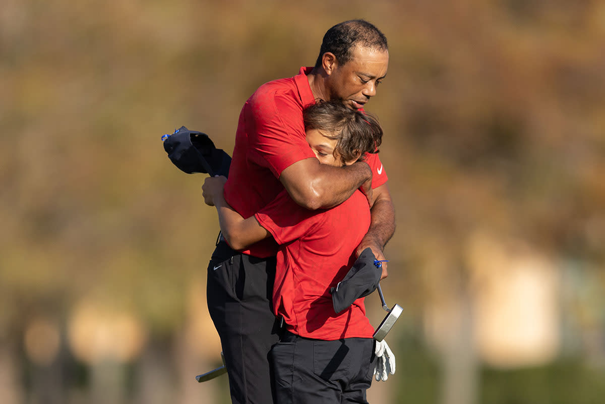 Tiger and Charlie Woods hug at the 2021 PNC Championship.