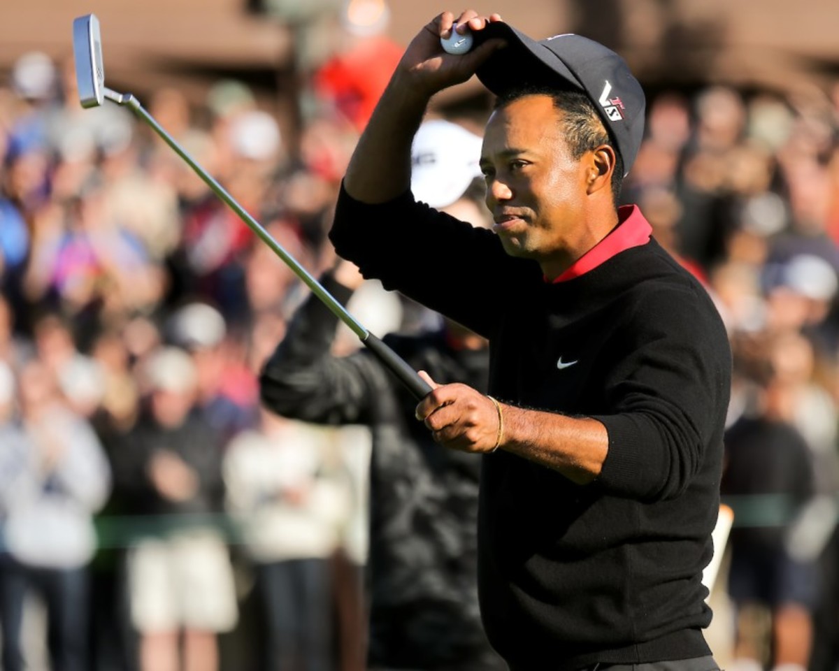 Tiger Woods strikes a familiar pose after another victory at Torrey Pines. 