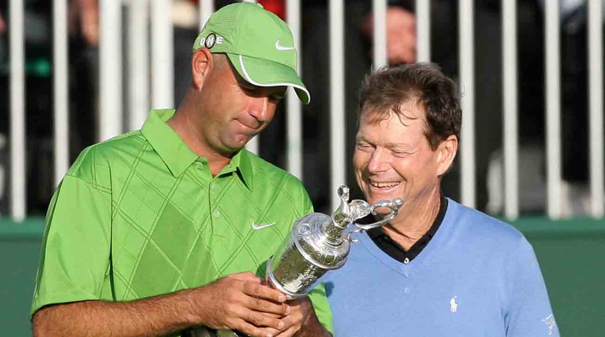 Stewart Cink and Tom Watson examine the Claret Jug after the 2009 British Open.