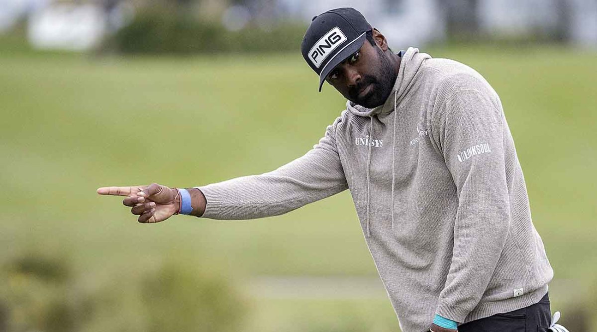 Sahith Theegala reacts after missing a birdie putt at the 2022 RSM Classic.
