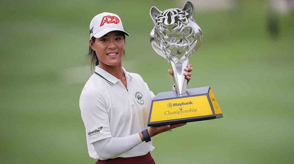 Celine Boutier of France celebrates with the winner's trophy after winning the final round of the 2023 LPGA Maybank Championship in Kuala Lumpur, Malaysia.