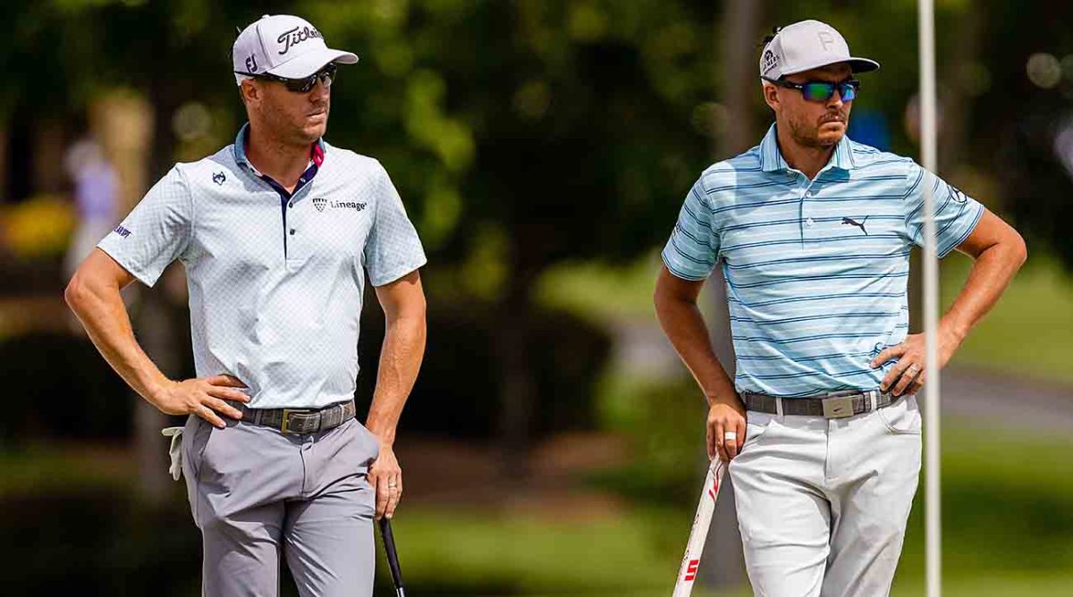 Justin Thomas and Rickie Fowler on the 4th green during the second round of the 2023 Wells Fargo Championship at Quail Hollow Club in Charlotte, N.C.