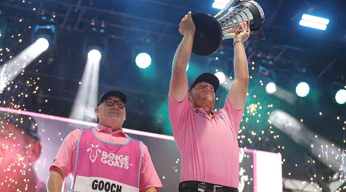Talor Gooch lifts the individual championship trophy after the final round of the 2023 LIV Golf Miami team championship at Trump National Doral.