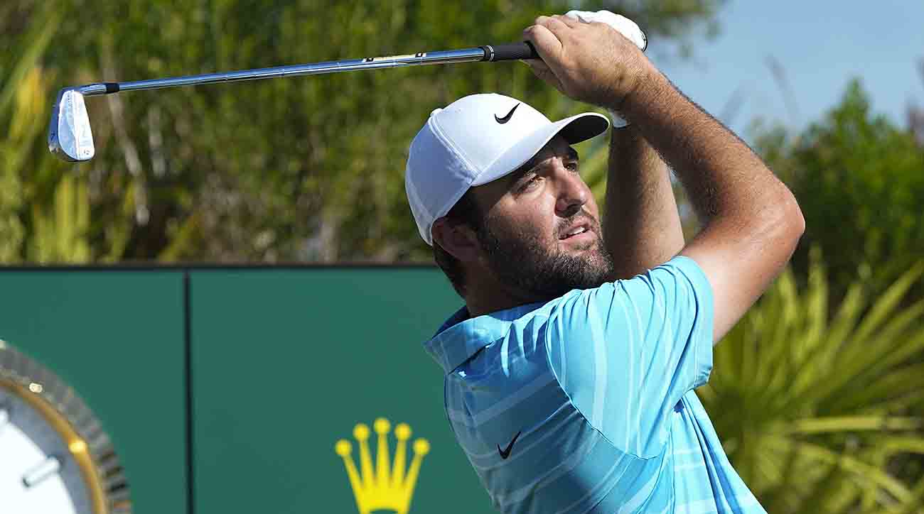 Scottie Scheffler watches his shot from the 2nd tee during the final round of the Hero World Challenge at the Albany Golf Club, in New Providence, Bahamas, Sunday, Dec. 3, 2023.