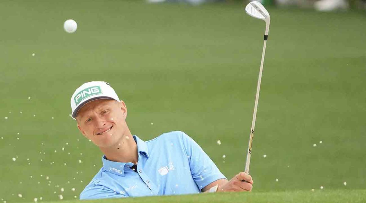 Adrian Meronk hits out of the bunker on the second hole during the first round of the 2023 Masters Tournament.
