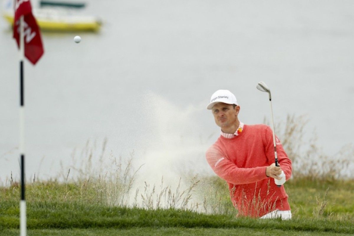 Justin Rose blasts to within 5 feet to save par at the par-3 fifth hole Thursday en route to a 6-under 65 and the 1st-round lead at the U.S. Open at Pebble Beach.