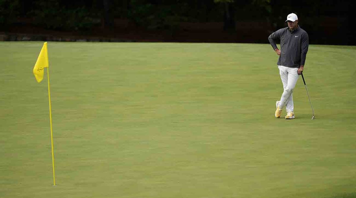 Brooks Koepka waits his turn to putt at the 2023 Masters.